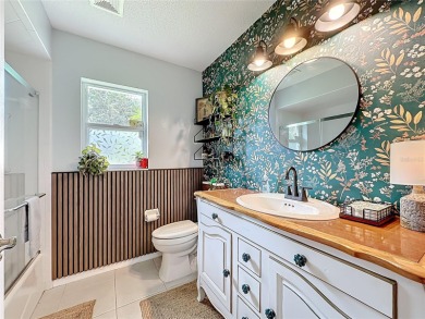 Welcome to this well-maintained 3-bedroom, 2-bath pool home on a on The Grand Club Cypress Course in Florida - for sale on GolfHomes.com, golf home, golf lot