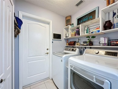 Welcome to this well-maintained 3-bedroom, 2-bath pool home on a on The Grand Club Cypress Course in Florida - for sale on GolfHomes.com, golf home, golf lot