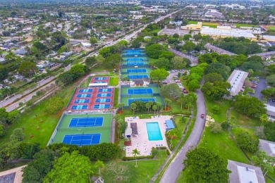 Welcome to your slice of paradise in the heart of Pompano Beach! on Wynmoor Golf Course in Florida - for sale on GolfHomes.com, golf home, golf lot