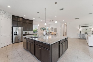 Welcome to luxurious living in the guard-gated Eagle Creek on Eagle Creek Golf Club in Florida - for sale on GolfHomes.com, golf home, golf lot