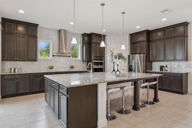 Welcome to luxurious living in the guard-gated Eagle Creek on Eagle Creek Golf Club in Florida - for sale on GolfHomes.com, golf home, golf lot