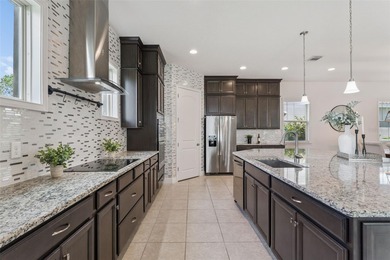 Welcome to luxurious living in the guard-gated Eagle Creek on Eagle Creek Golf Club in Florida - for sale on GolfHomes.com, golf home, golf lot