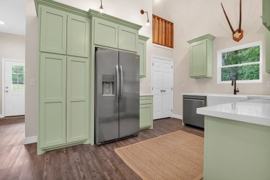 Modern Elegance meets Tranquil Luxury in this 2023-built on Rayburn Country Club in Texas - for sale on GolfHomes.com, golf home, golf lot