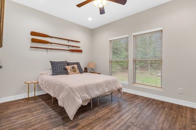 Modern Elegance meets Tranquil Luxury in this 2023-built on Rayburn Country Club in Texas - for sale on GolfHomes.com, golf home, golf lot