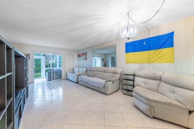 Welcome to your slice of paradise in the heart of Pompano Beach! on Wynmoor Golf Course in Florida - for sale on GolfHomes.com, golf home, golf lot