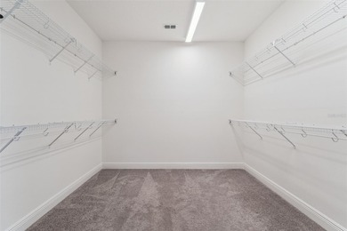 Welcome to luxurious living in the guard-gated Eagle Creek on Eagle Creek Golf Club in Florida - for sale on GolfHomes.com, golf home, golf lot