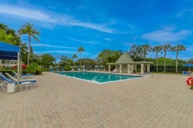 Welcome to your slice of paradise in the heart of Pompano Beach! on Wynmoor Golf Course in Florida - for sale on GolfHomes.com, golf home, golf lot