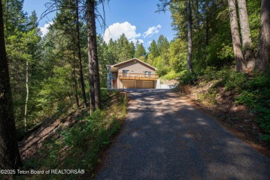 Surrounded by towering evergreens and endless mountain views on Star Valley RV Golf Course in Wyoming - for sale on GolfHomes.com, golf home, golf lot