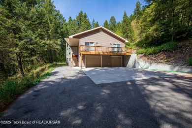 Surrounded by towering evergreens and endless mountain views on Star Valley RV Golf Course in Wyoming - for sale on GolfHomes.com, golf home, golf lot