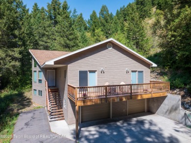 Surrounded by towering evergreens and endless mountain views on Star Valley RV Golf Course in Wyoming - for sale on GolfHomes.com, golf home, golf lot