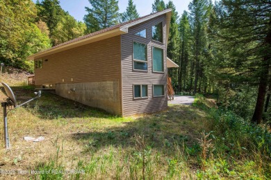 Surrounded by towering evergreens and endless mountain views on Star Valley RV Golf Course in Wyoming - for sale on GolfHomes.com, golf home, golf lot