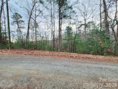 Tucked inside the gated community of Riverbend at Lake Lure on Lake Lure Municipal Golf Course in North Carolina - for sale on GolfHomes.com, golf home, golf lot