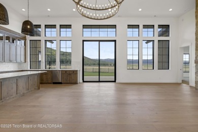 This custom home in Teton Reserve offers a unique plan with on Teton Reserve in Idaho - for sale on GolfHomes.com, golf home, golf lot