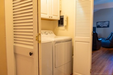 EXCEPTIONAL FIRST FLOOR END UNIT WITH GOLF COURSE FRONTAGE AND on  in Connecticut - for sale on GolfHomes.com, golf home, golf lot