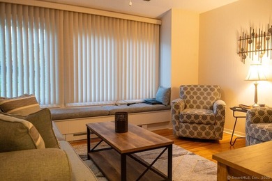 EXCEPTIONAL FIRST FLOOR END UNIT WITH GOLF COURSE FRONTAGE AND on  in Connecticut - for sale on GolfHomes.com, golf home, golf lot