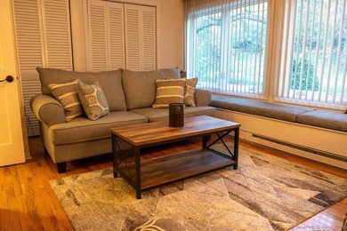 EXCEPTIONAL FIRST FLOOR END UNIT WITH GOLF COURSE FRONTAGE AND on  in Connecticut - for sale on GolfHomes.com, golf home, golf lot