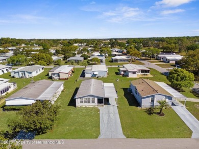 Welcome to this charming 2-BEDROOM, 2-BATHROOM, offering 1,178 on Brookridge Country Club in Florida - for sale on GolfHomes.com, golf home, golf lot