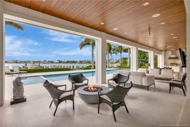 Experience the best of luxury living in this waterfront coastal on Sailfish Point Golf Club, Inc. in Florida - for sale on GolfHomes.com, golf home, golf lot