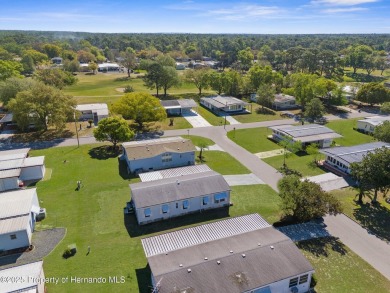 Welcome to this charming 2-BEDROOM, 2-BATHROOM, offering 1,178 on Brookridge Country Club in Florida - for sale on GolfHomes.com, golf home, golf lot