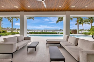 Experience the best of luxury living in this waterfront coastal on Sailfish Point Golf Club, Inc. in Florida - for sale on GolfHomes.com, golf home, golf lot