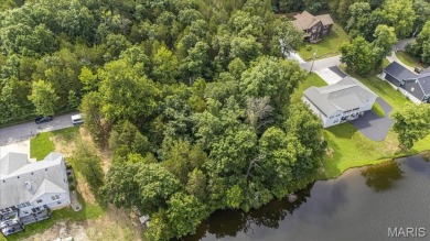 Lakefront Living at Its Finest! Nestled on a picturesque 1/2 on Raintree Country Club in Missouri - for sale on GolfHomes.com, golf home, golf lot