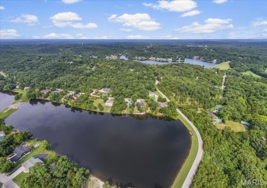 Lakefront Living at Its Finest! Nestled on a picturesque 1/2 on Raintree Country Club in Missouri - for sale on GolfHomes.com, golf home, golf lot