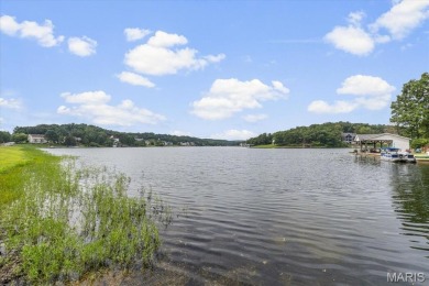 Lakefront Living at Its Finest! Nestled on a picturesque 1/2 on Raintree Country Club in Missouri - for sale on GolfHomes.com, golf home, golf lot
