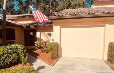Welcome home to this beautifully updated single-story residence on Martin Downs Country Club in Florida - for sale on GolfHomes.com, golf home, golf lot