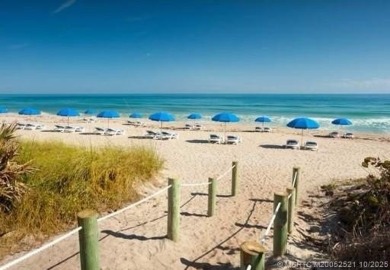 Enjoy breathtaking panoramic views of the golf course and lake on Ocean Club At the Hutchinson Island Beach Resort in Florida - for sale on GolfHomes.com, golf home, golf lot