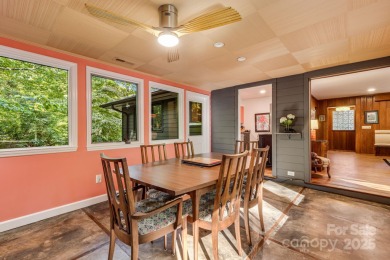 Access this beautifully remodeled Wright-inspired midcentury on Tryon Country Club in North Carolina - for sale on GolfHomes.com, golf home, golf lot