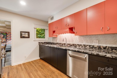 Access this beautifully remodeled Wright-inspired midcentury on Tryon Country Club in North Carolina - for sale on GolfHomes.com, golf home, golf lot