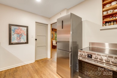 Access this beautifully remodeled Wright-inspired midcentury on Tryon Country Club in North Carolina - for sale on GolfHomes.com, golf home, golf lot