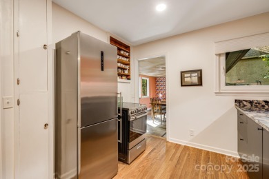 Access this beautifully remodeled Wright-inspired midcentury on Tryon Country Club in North Carolina - for sale on GolfHomes.com, golf home, golf lot