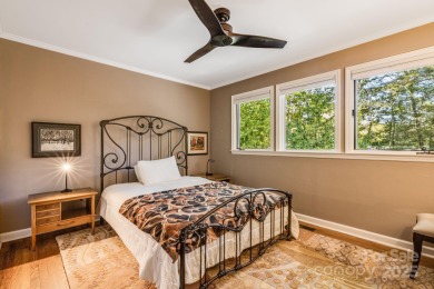 Access this beautifully remodeled Wright-inspired midcentury on Tryon Country Club in North Carolina - for sale on GolfHomes.com, golf home, golf lot