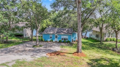 This quaint and charming lakefront bungalow offers a peaceful on Linn Valley Lakes - Deer Trace Golf Course in Kansas - for sale on GolfHomes.com, golf home, golf lot