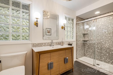 Access this beautifully remodeled Wright-inspired midcentury on Tryon Country Club in North Carolina - for sale on GolfHomes.com, golf home, golf lot