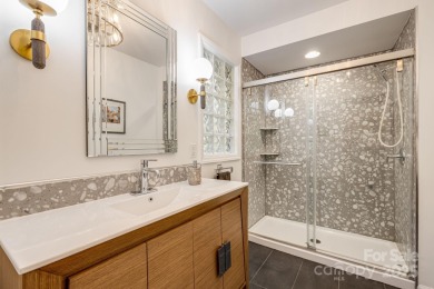 Access this beautifully remodeled Wright-inspired midcentury on Tryon Country Club in North Carolina - for sale on GolfHomes.com, golf home, golf lot