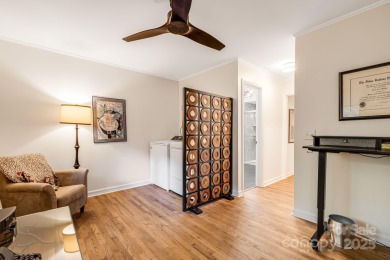 Access this beautifully remodeled Wright-inspired midcentury on Tryon Country Club in North Carolina - for sale on GolfHomes.com, golf home, golf lot
