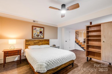 Access this beautifully remodeled Wright-inspired midcentury on Tryon Country Club in North Carolina - for sale on GolfHomes.com, golf home, golf lot