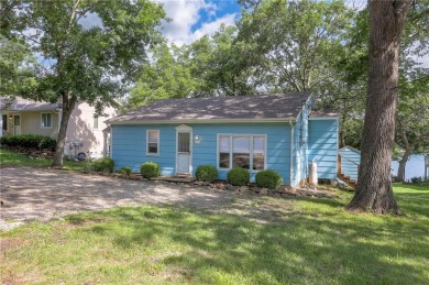 This quaint and charming lakefront bungalow offers a peaceful on Linn Valley Lakes - Deer Trace Golf Course in Kansas - for sale on GolfHomes.com, golf home, golf lot