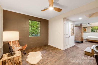Access this beautifully remodeled Wright-inspired midcentury on Tryon Country Club in North Carolina - for sale on GolfHomes.com, golf home, golf lot