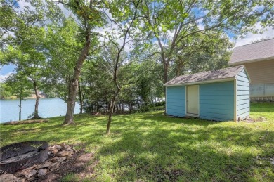 This quaint and charming lakefront bungalow offers a peaceful on Linn Valley Lakes - Deer Trace Golf Course in Kansas - for sale on GolfHomes.com, golf home, golf lot