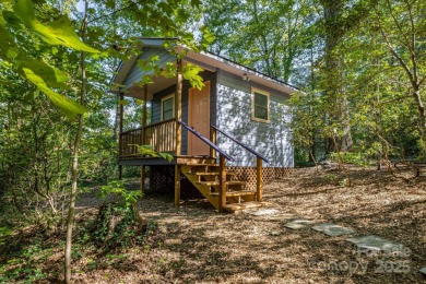 Access this beautifully remodeled Wright-inspired midcentury on Tryon Country Club in North Carolina - for sale on GolfHomes.com, golf home, golf lot