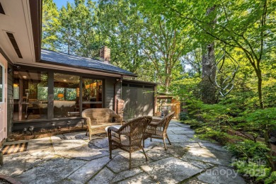 Access this beautifully remodeled Wright-inspired midcentury on Tryon Country Club in North Carolina - for sale on GolfHomes.com, golf home, golf lot