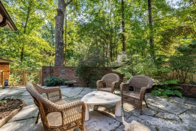 Access this beautifully remodeled Wright-inspired midcentury on Tryon Country Club in North Carolina - for sale on GolfHomes.com, golf home, golf lot
