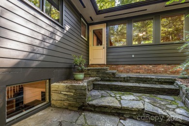 Access this beautifully remodeled Wright-inspired midcentury on Tryon Country Club in North Carolina - for sale on GolfHomes.com, golf home, golf lot