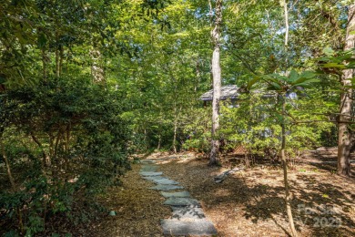 Access this beautifully remodeled Wright-inspired midcentury on Tryon Country Club in North Carolina - for sale on GolfHomes.com, golf home, golf lot