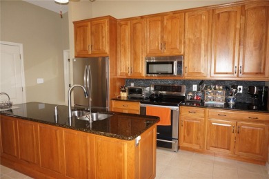 Impressive 3 Bedroom, 2 Bathroom WATERFRONT home with attached 2 on Saint Andrews South Golf Club in Florida - for sale on GolfHomes.com, golf home, golf lot
