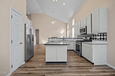 Welcome home to this beautifully maintained 3,061 sq ft on TPC at Wakefield Plantation in North Carolina - for sale on GolfHomes.com, golf home, golf lot