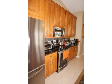 Impressive 3 Bedroom, 2 Bathroom WATERFRONT home with attached 2 on Saint Andrews South Golf Club in Florida - for sale on GolfHomes.com, golf home, golf lot